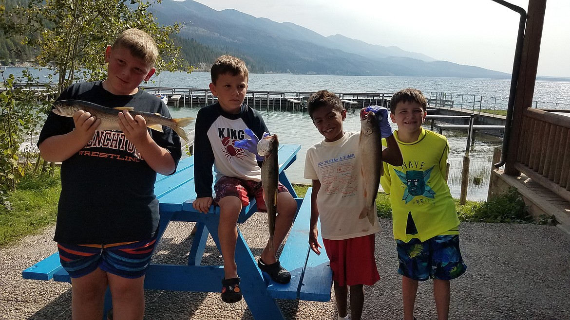 Holden Griffin, Bear Yarrow, Ace Whimper and Bucky Yarrow of Clinton with lake trout entries at Fall Mack Days on Flathead Lake.