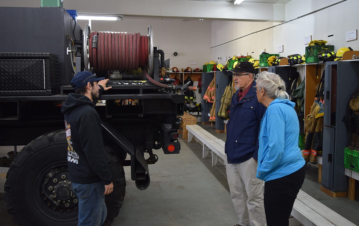 Soap Lake residents Don Long and his wife, Colleen Long, tour the Grant County Fire District 7 station in Soap Lake with a volunteer firefighter during Saturday’s open house event.