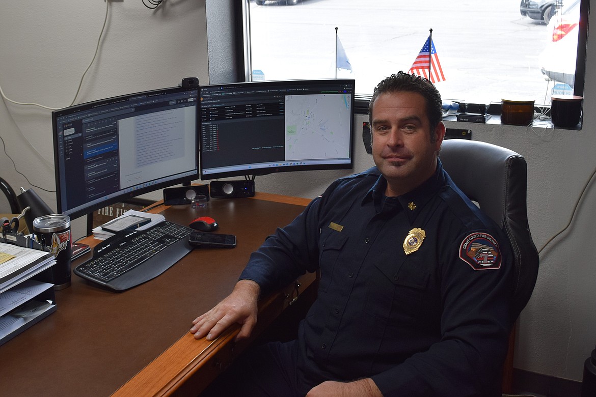 Grant County Fire District 7 Fire Chief Chris Baker sits in his office in the Soap Lake fire station during the open house Saturday.