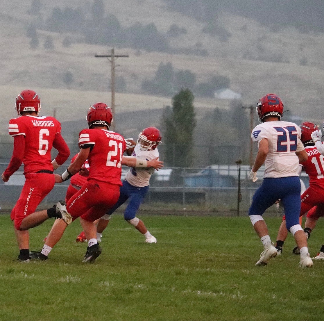 Superior running back Lucas Kovalsky is surrounded by Arlee Warriors as he looks for running room during their game Friday night in Arlee. (Photo by Kami Milender)