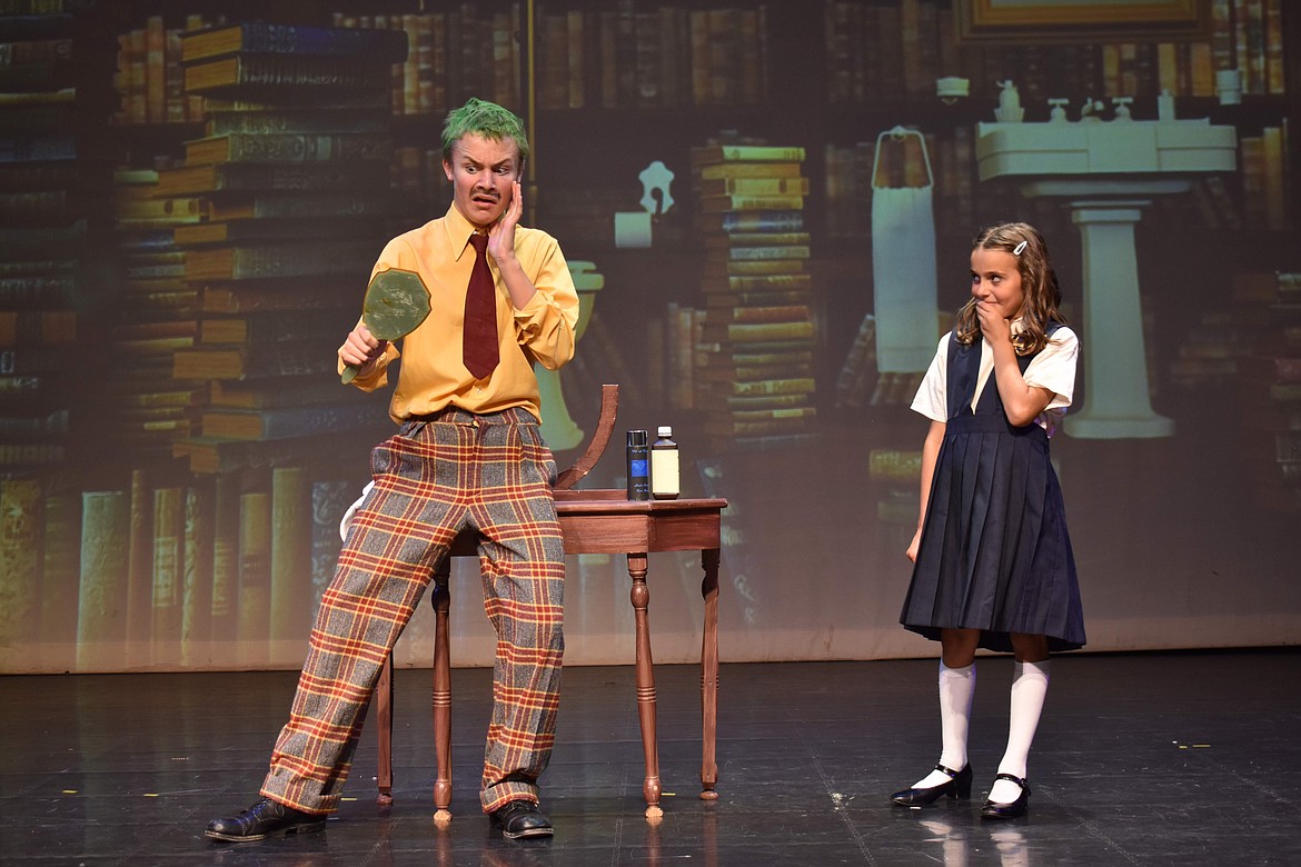 Matilda (Khloe Kosturos) tries to keep her dad, Mr. Wormwood (Brody Henion) from cheating a customer in a car deal in a scene featuring the song “Naughty" in the Bigfork Playhouse Children's Theatre perfomance of "Matilda Jr." This is the last week to performances. (Photo provided by Bigfork Playhouse Children's Theatre)
