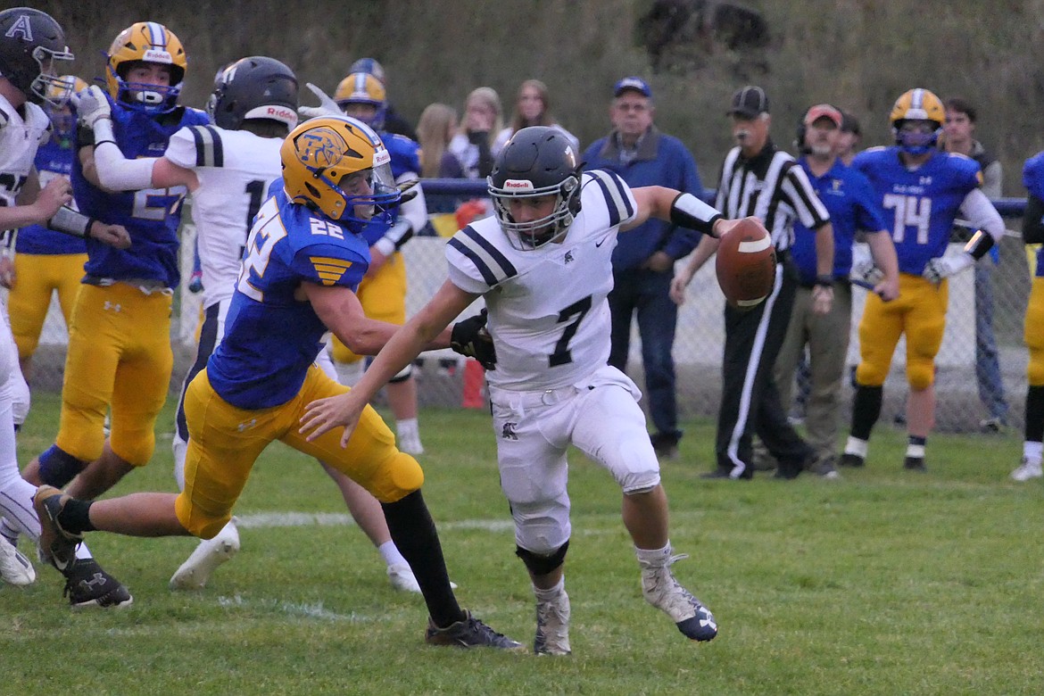 Thompson Falls' Braedon Ferris gets ahold of Anaconda quarterback Corey Galle during the Blue Hawks homecoming win over the Copperheads Friday night in T-Falls.  (Chuck Bandel/VP-MI)