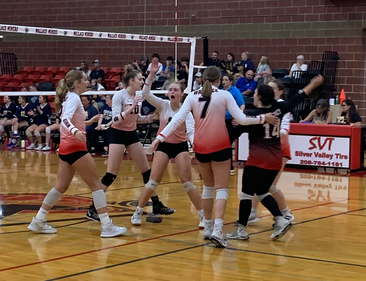 The undefeated Lady Miners celebrate during a recent win over St. Regis.