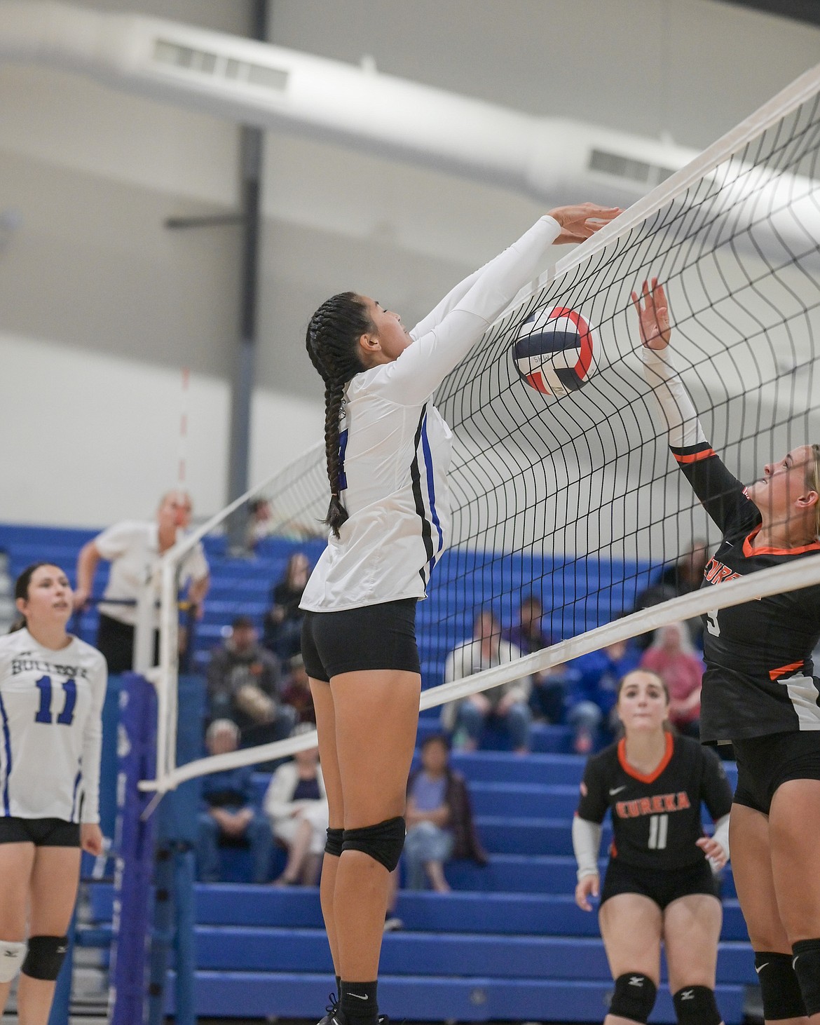 Mission's Cora Matt tips the ball over the net during last Thursday's game against Eureka. (Christa Umphrey photo)