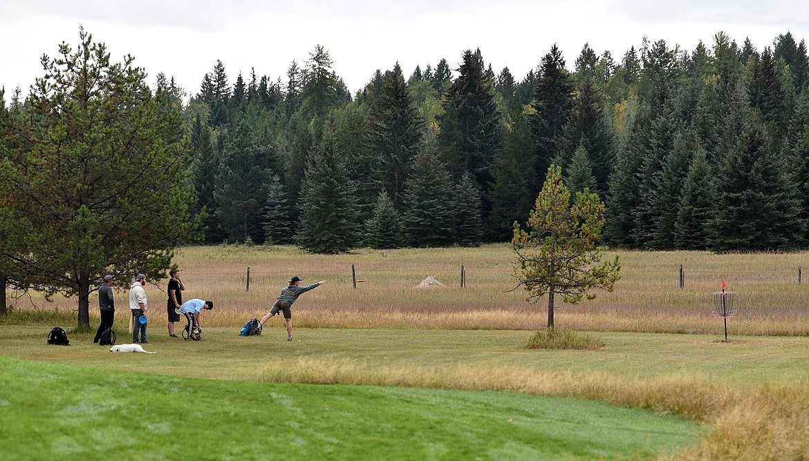 A team finishes a hole at the Stumptown Fish Toss disc golf tournament last weekend at the Whitefish Assembly of God church. (Julie Engler/Whitefish Pilot)