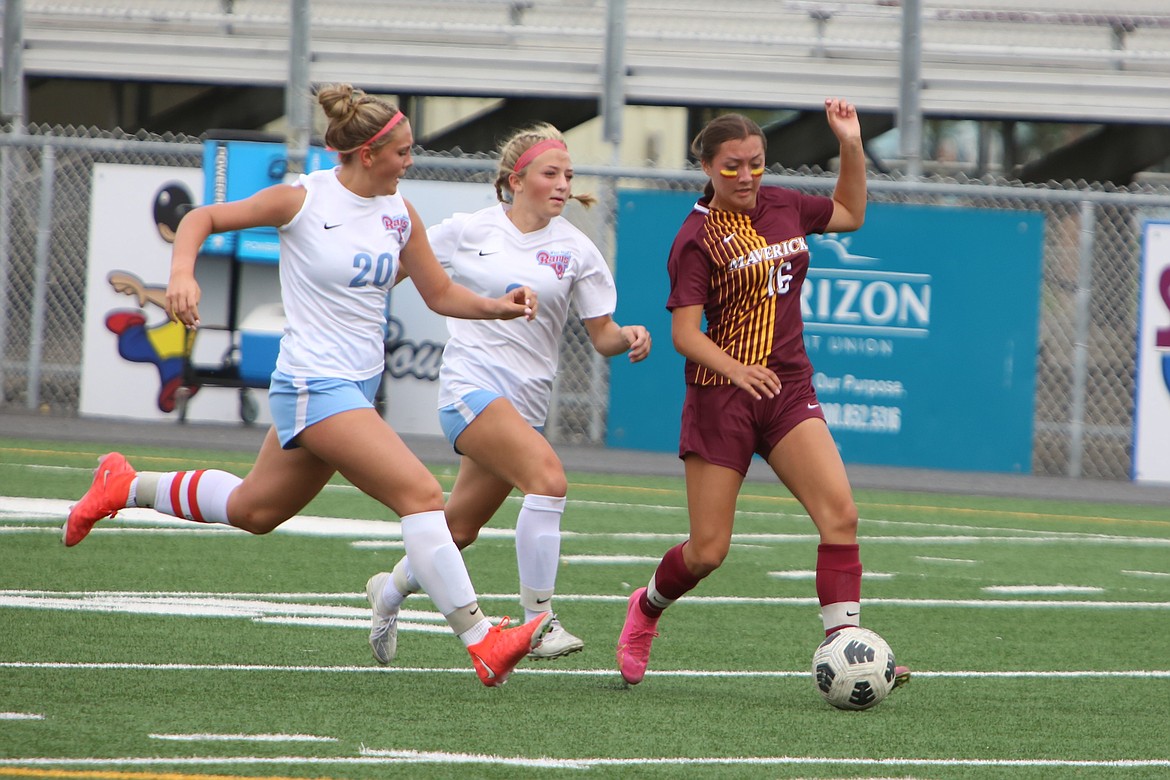 Moses Lake freshman Kamery Char (16) runs upfield past two West Valley (Yakima) defenders in Saturday’s 2-0 win over the Rams.