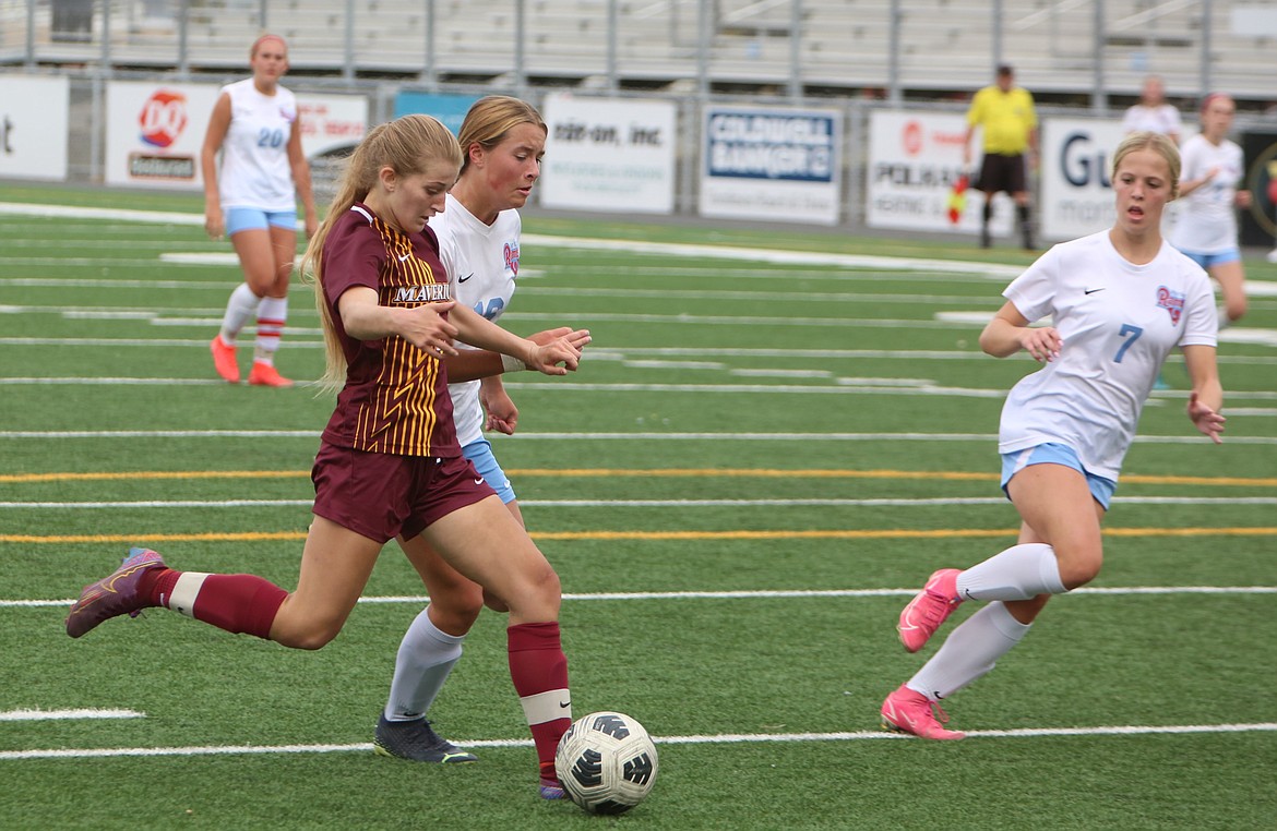 Moses Lake sophomore Reese Prescott, in maroon, takes a shot on the West Valley (Yakima) goal in the second half against the Rams.