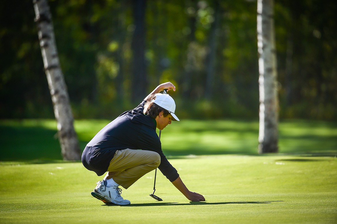 Whitefish's Riley Brown lines up a putt on the 11th green during the Western A Divisional tournament at Whitefish Lake Golf Club on Thursday, Sept. 21. (Casey Kreider/Daily Inter Lake)