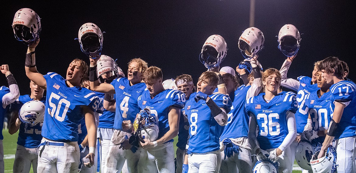 The football team leads the crowd in the Wildcats Fight Song after defeating Polson 42-0 for Homecoming on Friday, Sept. 22. (Avery Howe photo).