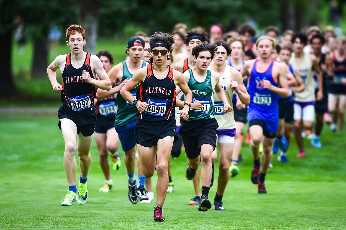 Flathead's Robbie Nuila and Kasen Kastner run the course early in the race at the Whitefish Invite at Whitefish Lake Golf Club on Tuesday, Sept. 26. (Casey Kreider/Daily Inter Lake)