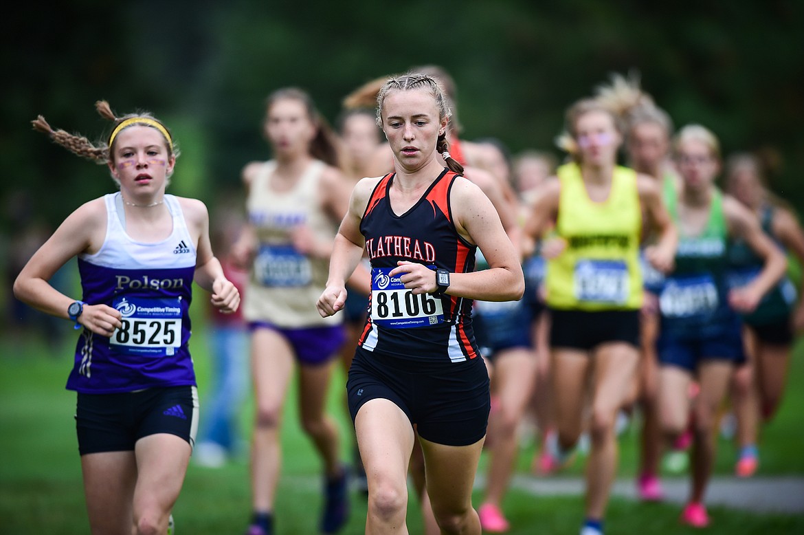 Polson's Morgan Delaney and Flathead's Josie Wilson run the course during the Whitefish Invite at Whitefish Lake Golf Club on Tuesday, Sept. 26. (Casey Kreider/Daily Inter Lake)