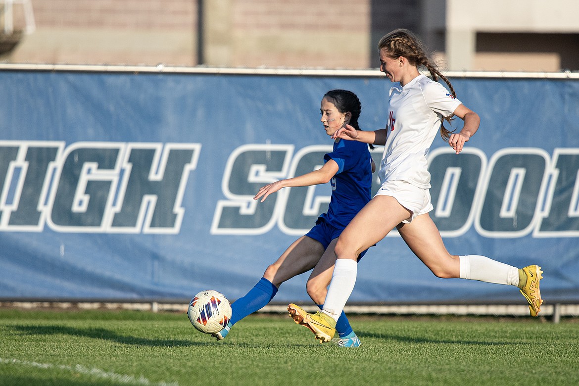 Sophomore Taylor Rodgers beats Bigfork downfield to score Columbia Falls’ second goal in their Homecoming match on Saturday, Sept. 23. (Avery Howe photo).