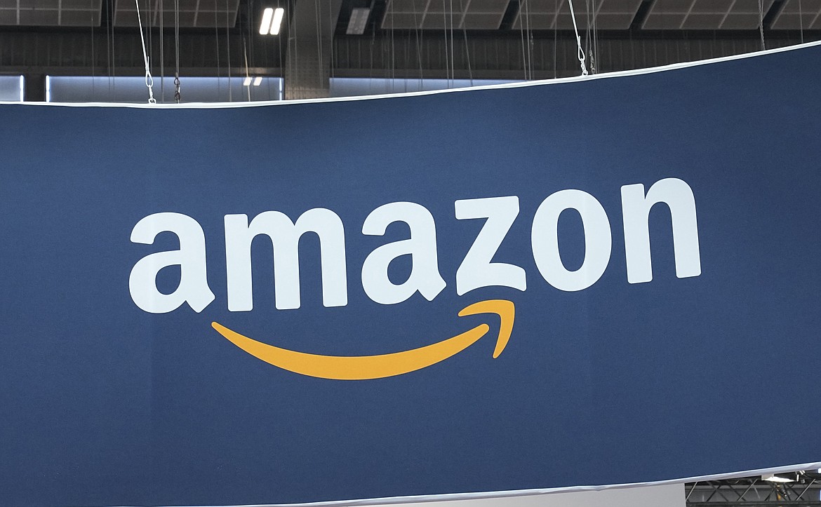 FILE - The Amazon logo is photographed at the Vivatech show in Paris, on June 15, 2023. Amazon is investing up to $4 billion in Anthropic and taking a minority stake in the artificial intelligence startup, the two companies said Monday Sept. 25, 2023. (AP Photo/Michel Euler, File)