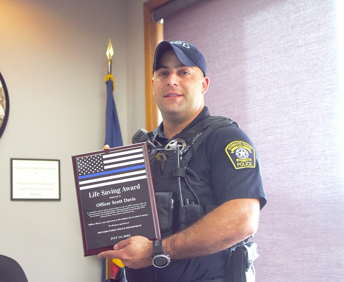 BFPD Officer Scott Davis with his Life Saving Award.