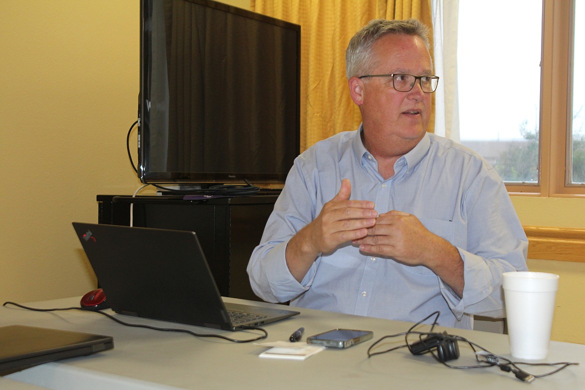 Joe Kunkel, a consultant on construction for the new Quincy Valley Medical Center, updates the hospital commissioners on the project Monday.