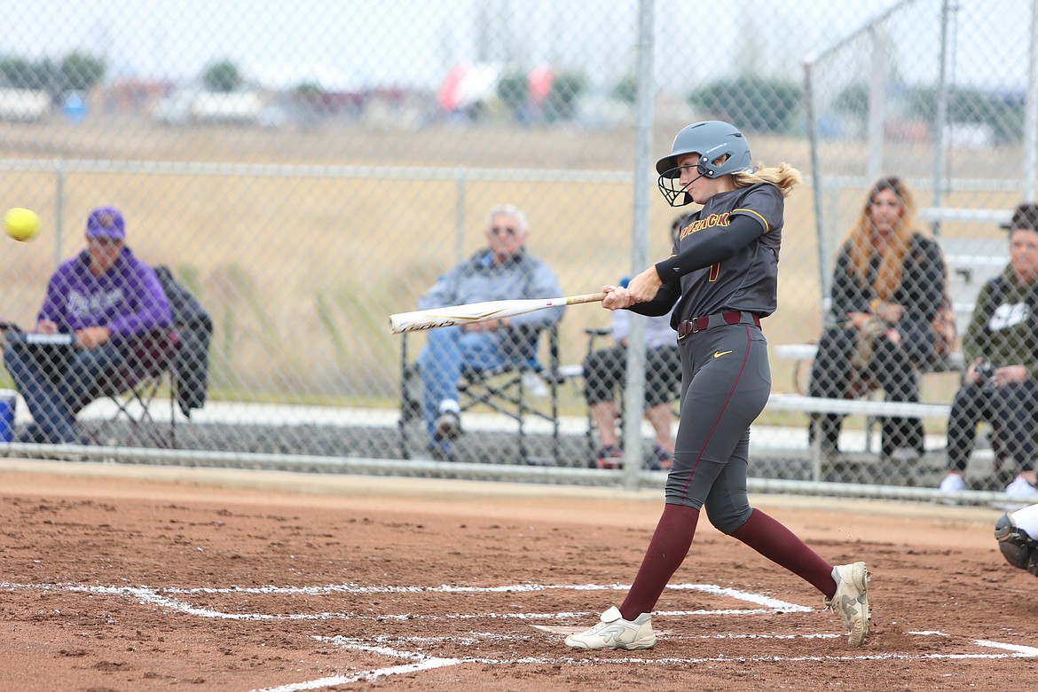 Moses Lake senior Morgan Ross (1) makes contact with a pitch against Wenatchee on Monday afternoon.