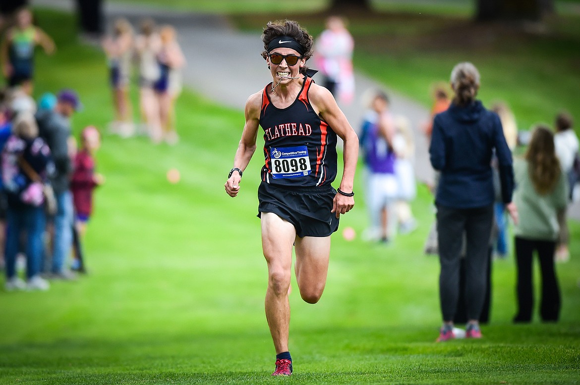 Flathead's Robbie Nuila pushes up the last incline toward a first-place finish in the boys race at the Whitefish Invite at Whitefish Lake Golf Club on Tuesday, Sept. 26. (Casey Kreider/Daily Inter Lake)