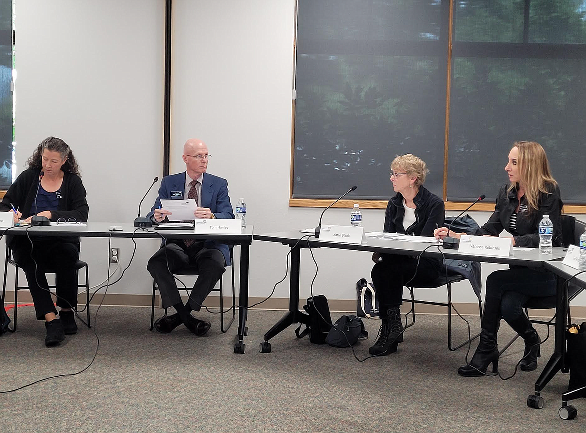 Community Library Network trustees discuss insurance and a possible lapse of coverage Wednesday during a special meeting at the Post Falls Library. From left: Chair Rachelle Ottosen, Vice Chair Tom Hanley, Trustee Katie Blank and Trustee Vanessa Robinson.