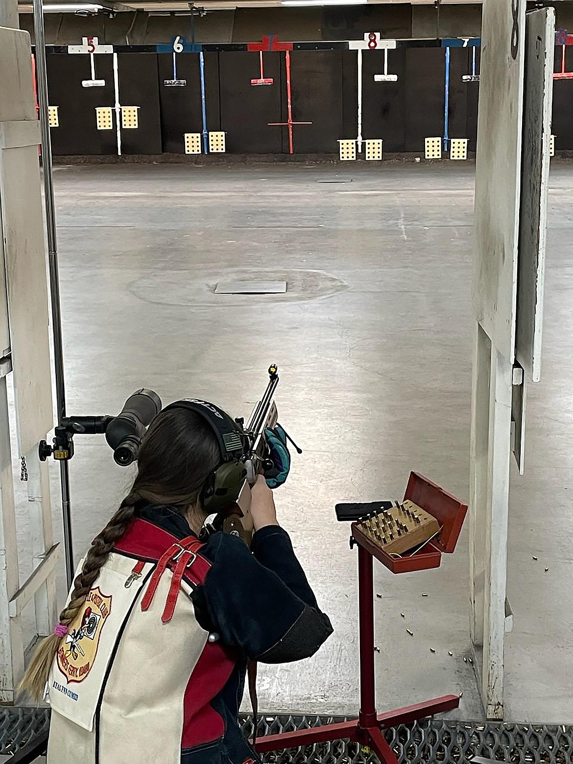 Kyalynn Comer is pictured shooting at a target from the kneeling position during a recent competition.