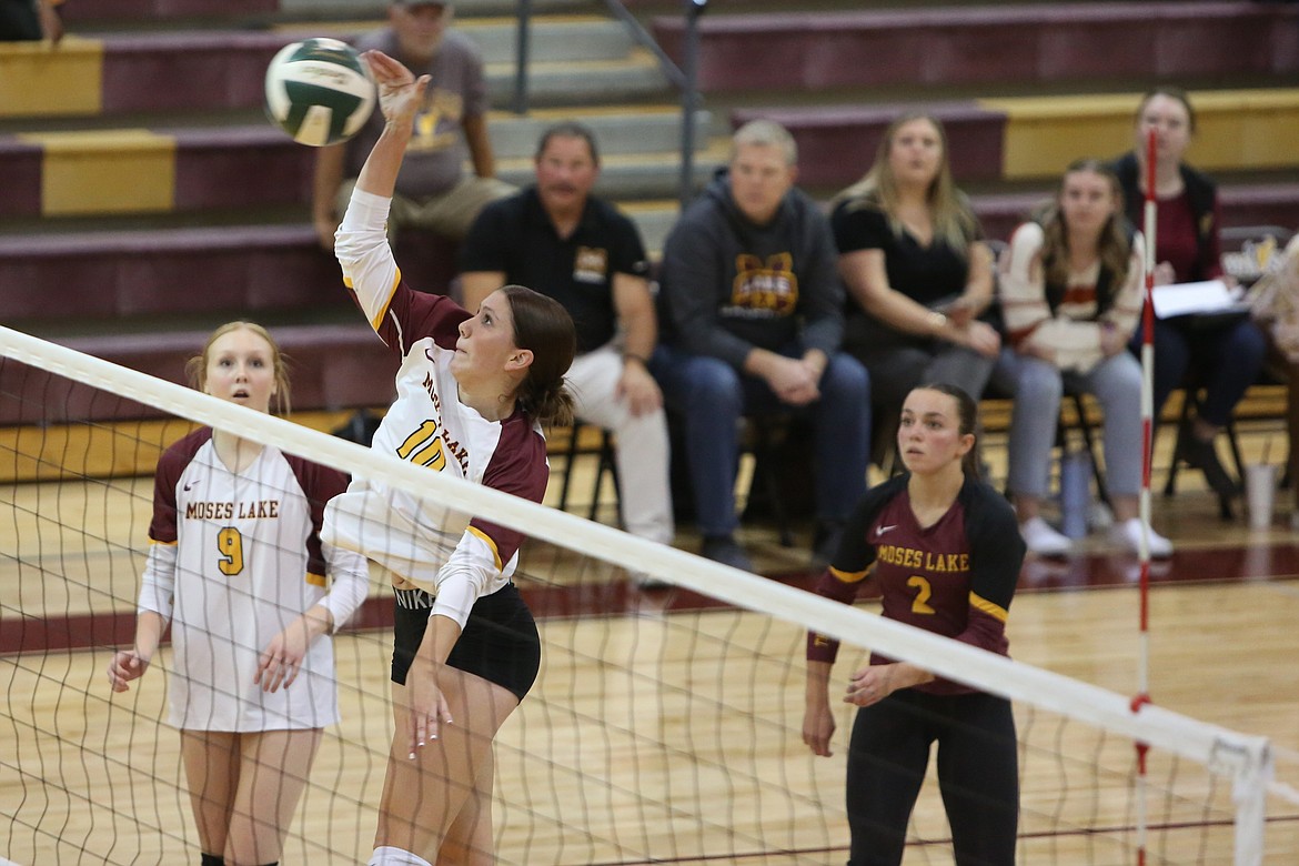 Moses Lake junior Makenna Stuart spikes the ball for a kill against Davis on Tuesday.