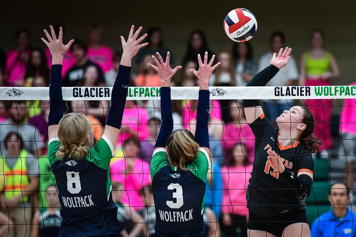 Flathead's Olive Lyngholm (13) goes to the net for a kill against Glacier at Glacier High School on Thursday, Sept. 28. (Casey Kreider/Daily Inter Lake)