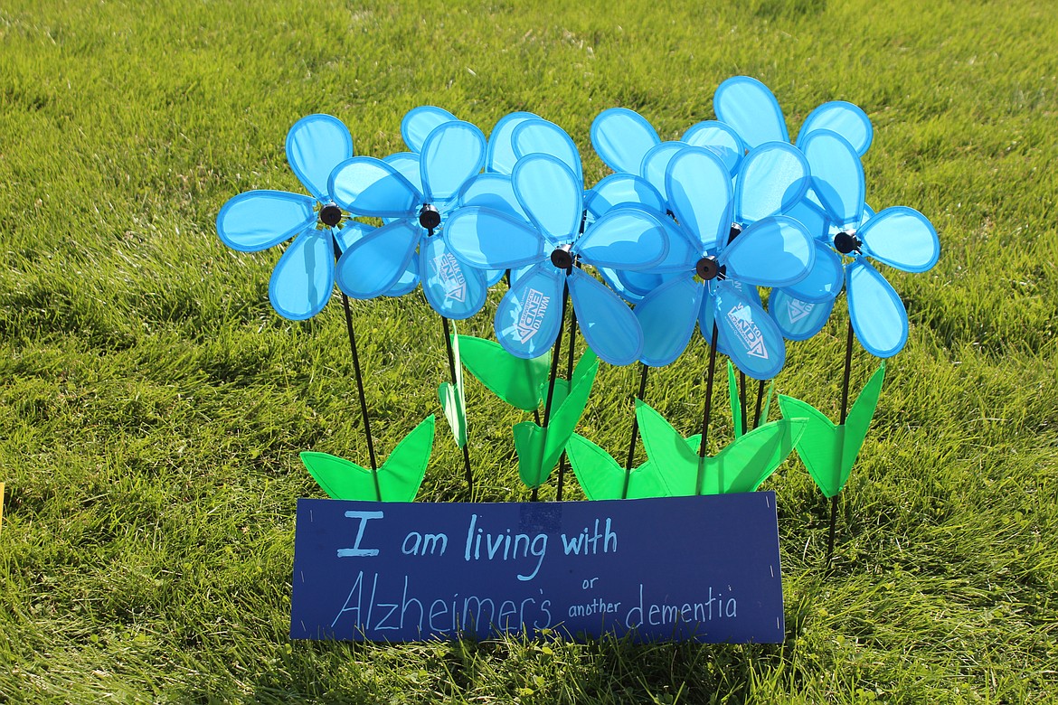 Blue flowers commemorate people living with Alzheimer’s and other forms of dementia, frontotemporal dementia among them, at the Sept. 16 Walk to End Alzheimer’s in Moses Lake.