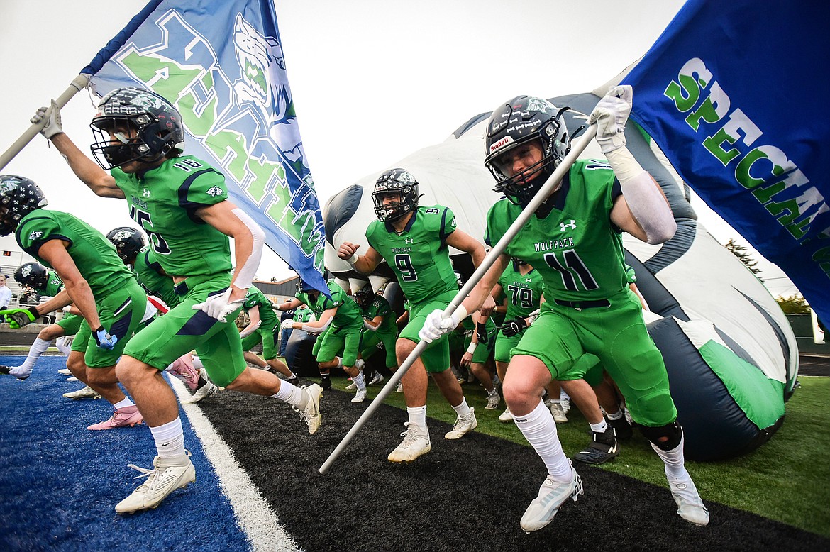 The Glacier Wolfpack take the field before their game with the Helena Capital Bruins at Legends Stadium on Friday, Sept. 29. (Casey Kreider/Daily Inter Lake)