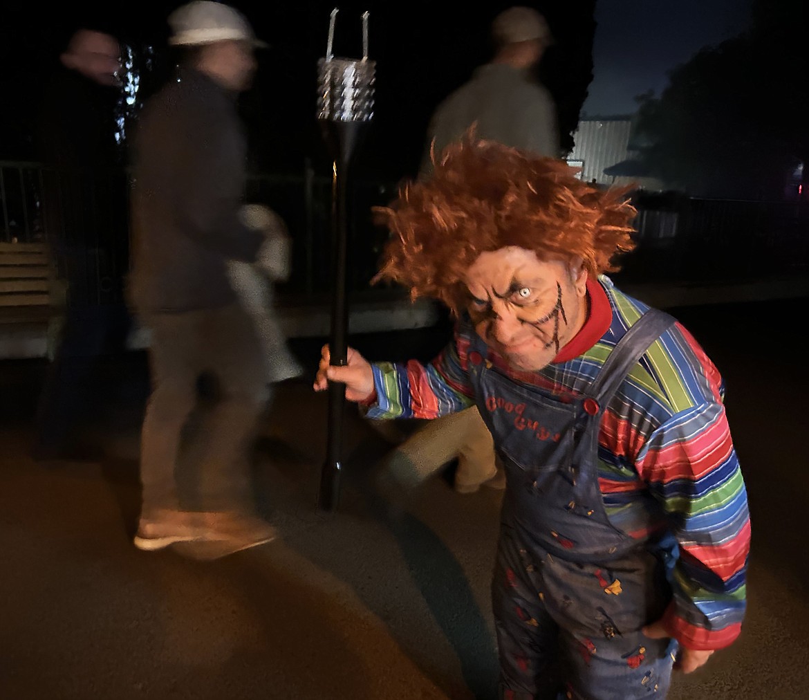 Scarywood's guests sneak past Chucky played by Brian Tortarolo on Friday.