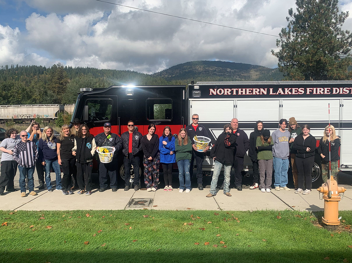 The Northern Lakes Fire District firefighters and crew pose for a photo with the Mountain View Alternative High School senior class. The seniors delivered the baskets as a thank you to first responders Friday.