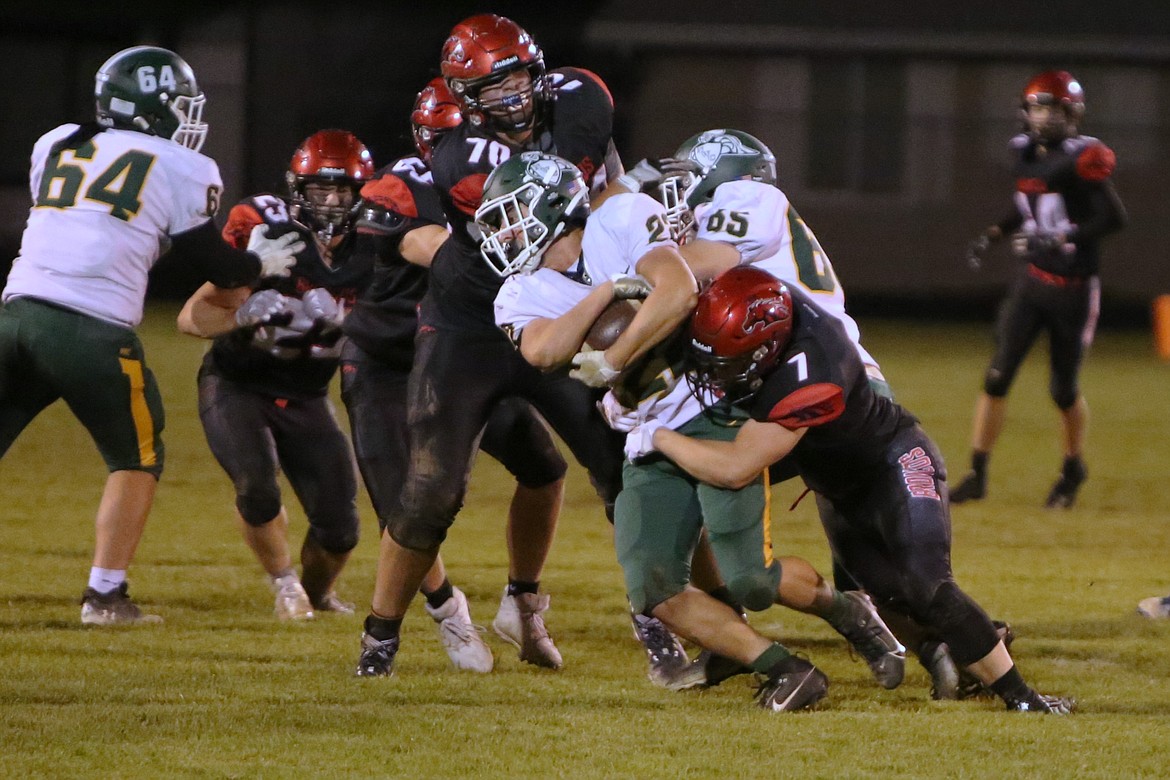 Lind-Ritzville/Sprague senior Gabe Smith (7) and junior Brock Tracy (70) go in for a tackle against Northwest Christian.