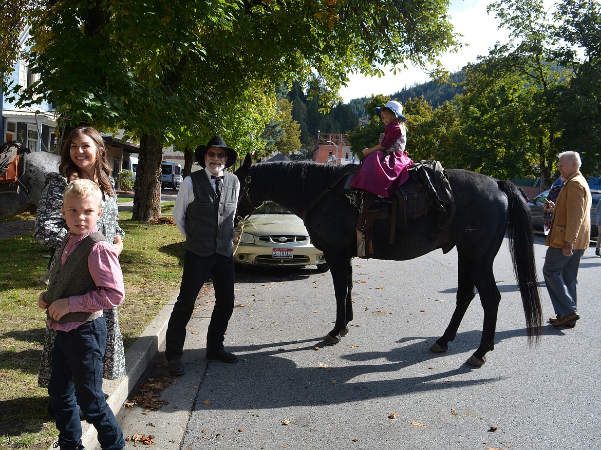 Brian Anderson smiles as he brings Jane Lee and Roanie the horse in a loop outside the Prayer Station. Children attending the Fall for History church service were allowed to take a ride on Roanie or the Blue Man.