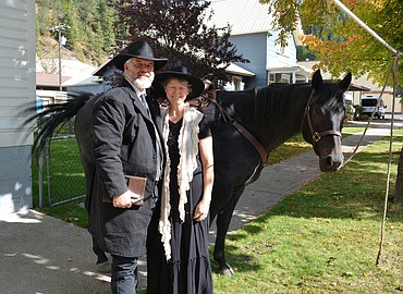 Reverend Chuck Cushman and Susan Cushman stand by Roanie the horse outside the Prayer Station in Wallace. Chuck had ridden into Wallace on horseback while his wife, Susan, had made the journey from Swan Lake, Mont., by car.