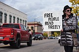 Protestors seek to draw attention to Banned Books Week following board decision