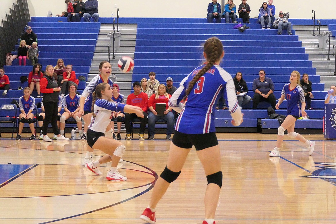 Superior sophomore records a "dig" while teammate Josie Crabb (3) waits for a set during the Lady Bobcats match against St. Ignatius this past Saturday. (Chuck Bandel/MI-VP)