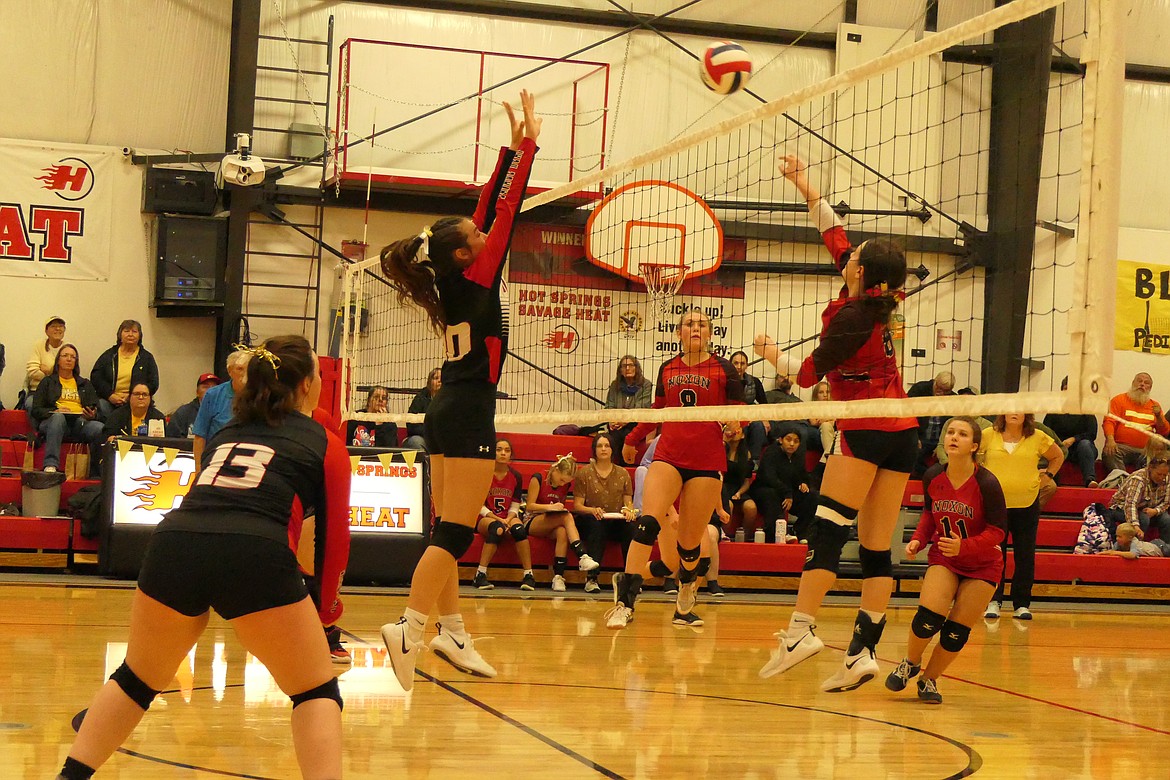 Hot Springs freshman Kara Christensen attempts to block a shot by Noxon senior Mia Vogel during their match this past Saturday in Hot Springs.  (Chuck Bandel/VP-MI)