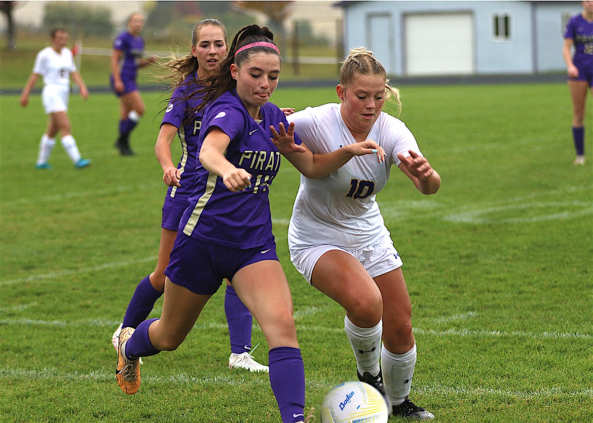 Polson's Madi Lake fights for control of the ball during last week's match against Libby. (Bob Gunderson photo)