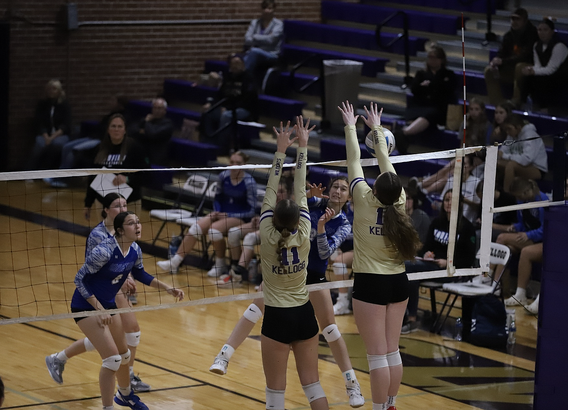 Maddie Cheney (12) and Dani Schillereff (11) block an Orofino hit during last week's Central Idaho League win over the Maniacs.