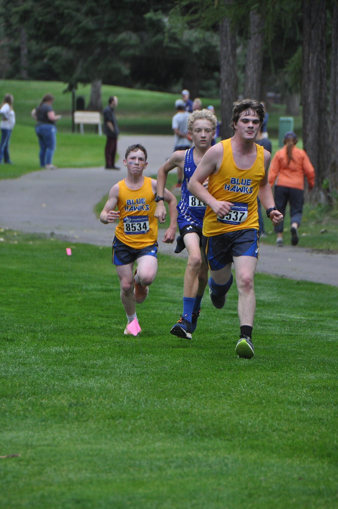 Thompson Falls runners Brock Ryan (8537) and Weston Block head for the finish line of the Whitefish XC Invitational this past week.   (Photo by Sarah Naegeli)