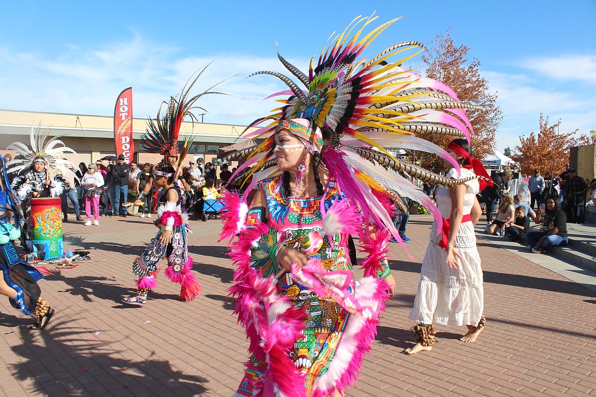 A dancer with the CeAtl Tonalli performs a dance with roots dating back to the Aztecs at the UMANI Festival Saturday in Moses Lake.