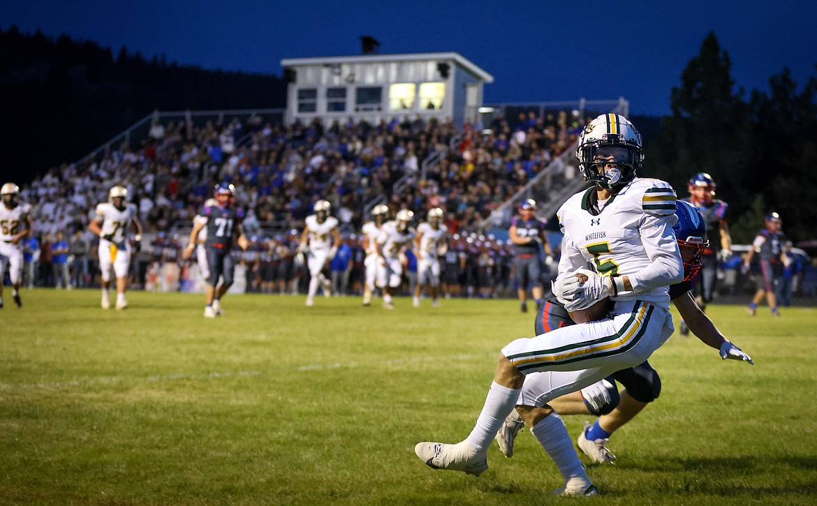 Receiver Jesse Burrough hauls in an 11-yard touchdown pass to put the Bulldogs up 13-7 in the second quarter at Bigfork Friday. (Jeremy Weber/Bigfork Eagle)