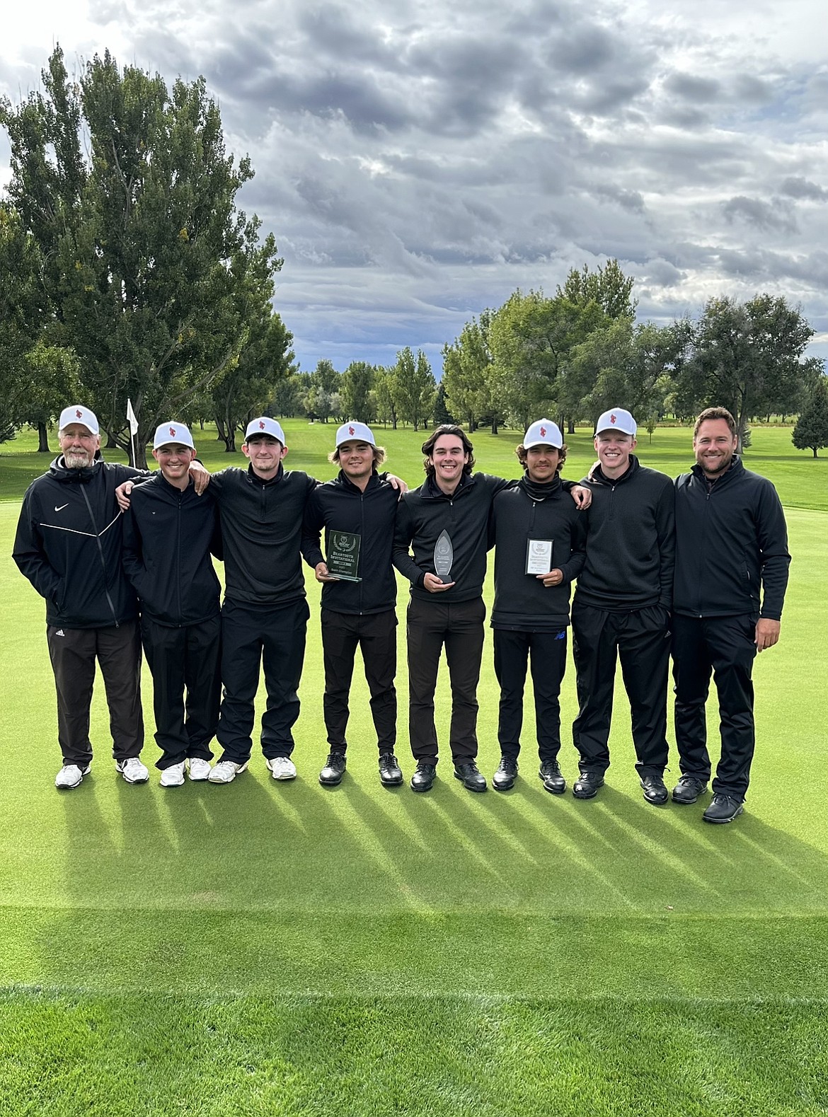 Courtesy photo
The North Idaho College men's golf team captures the team title at the Beartooth Invitational on Tuesday at Laurel Golf Club. The Cardinals were the only team to finish under par as a team, winning with an 856. From left are assistant coach Russ Grove, Dyson Lish, Caden Gambini, Charlie Terwilliger, Josh McCartain, Jarett Giles, Quinn Abbott and coach Russell Grove.