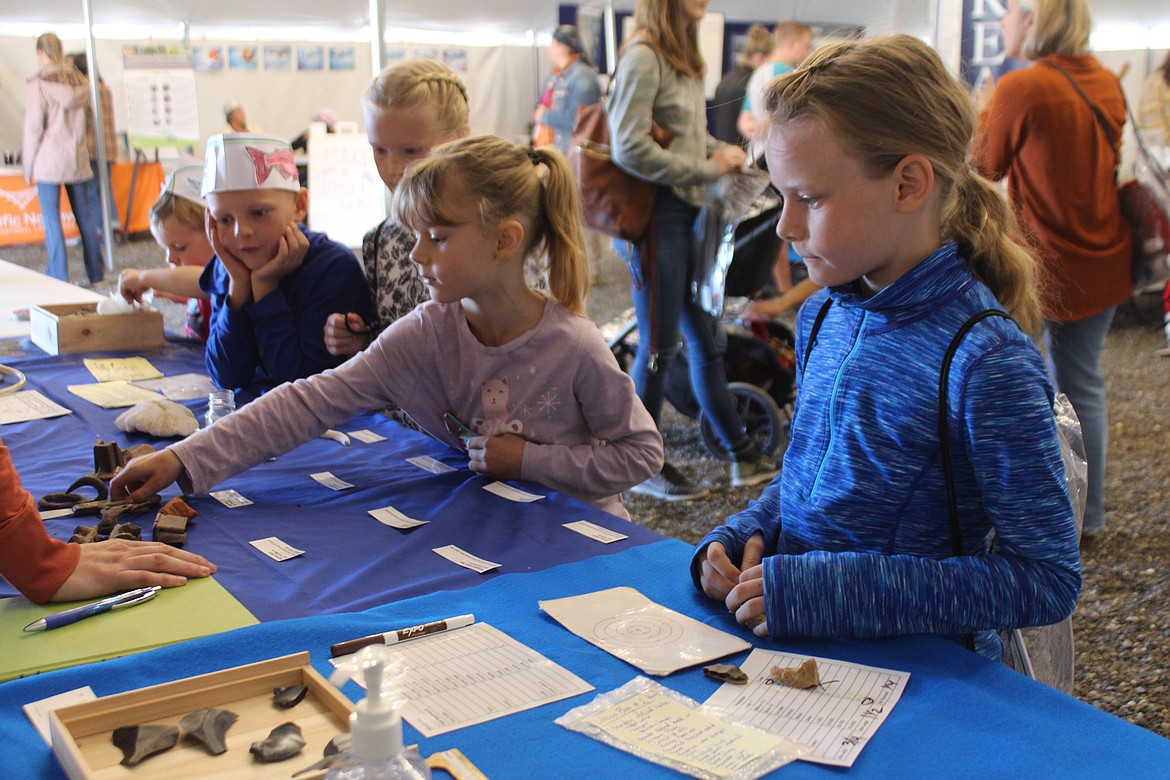 An Archaeology Days participant plays the game of identifying desert artifacts.