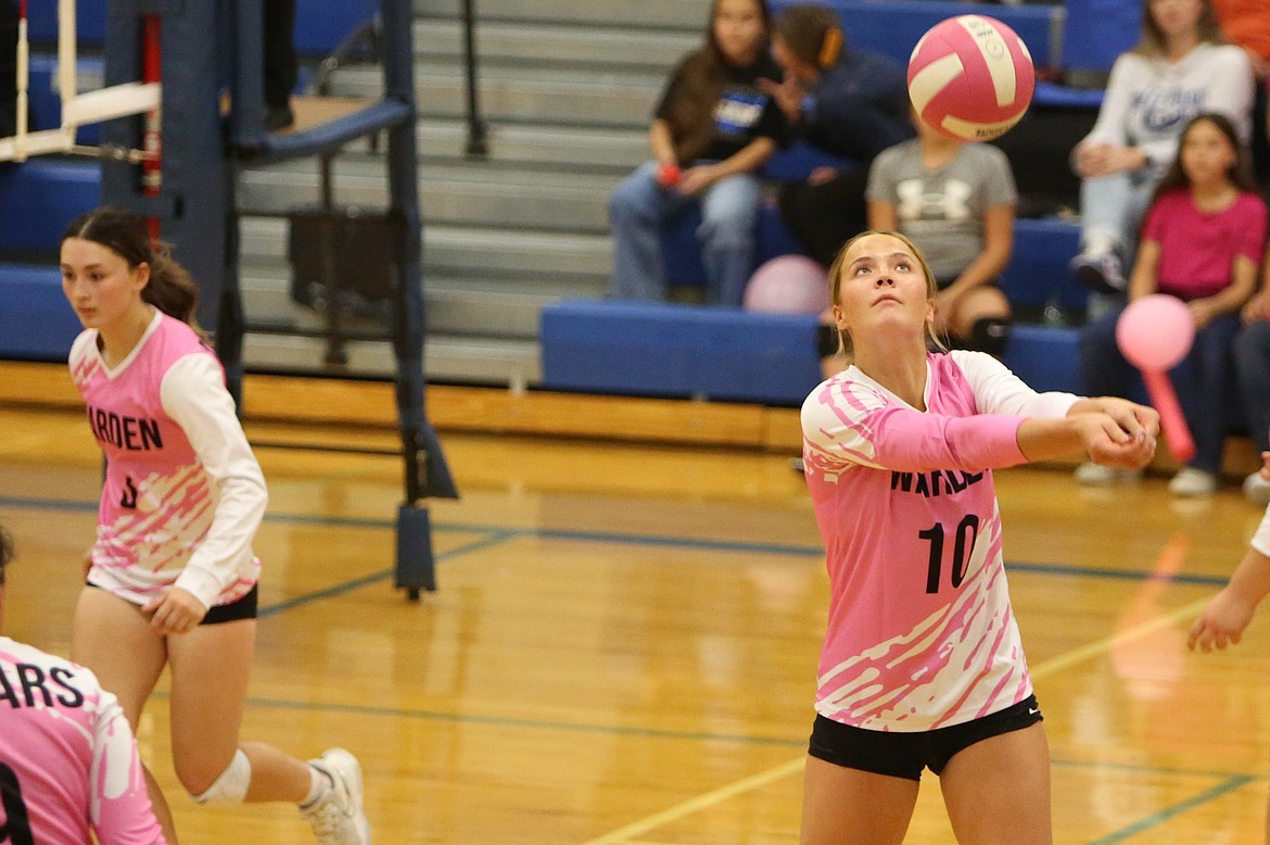 Warden senior Lauryn Madsen sets up for a bump in the fourth set against River View on Tuesday night.