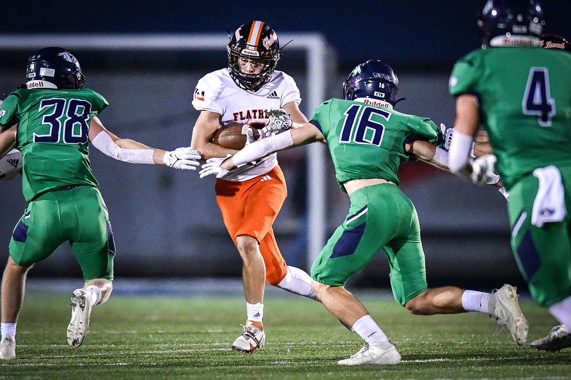 Flathead wide receiver Ben Bliven (2) looks for running room on a run in the second quarter against Glacier at Legends Stadium on Thursday, Oct. 5. (Casey Kreider/Daily Inter Lake)