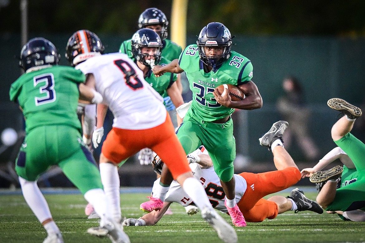 Glacier kick returner Kobe Dorcheus (33) looks for an opening on a return in the first quarter against Flathead at Legends Stadium on Thursday, Oct. 5. (Casey Kreider/Daily Inter Lake)