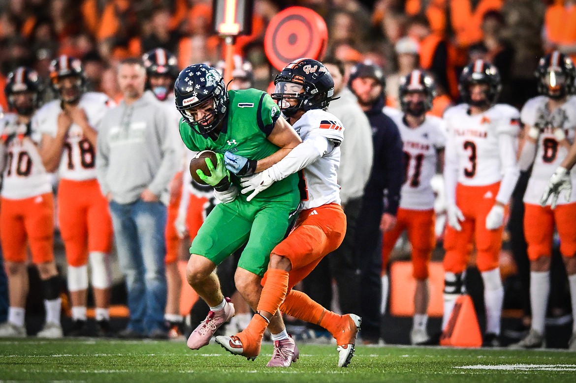 Glacier wide receiver Cohen Kastelitz (1) is brought down by Flathead linebacker Jaden Williams (1) after a reception in the first quarter at Legends Stadium on Thursday, Oct. 5. (Casey Kreider/Daily Inter Lake)