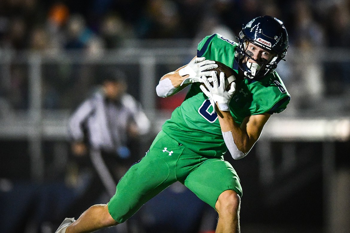 Glacier wide receiver Evan Barnes (8) pulls in a 35-yard touchdown reception from quarterback Jackson Presley in the second quarter against Flathead at Legends Stadium on Thursday, Oct. 5. (Casey Kreider/Daily Inter Lake)