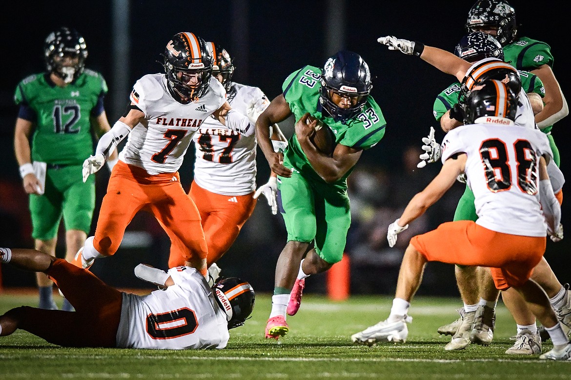 Glacier running back Kobe Dorcheus (33) looks for running room in the second quarter against Flathead at Legends Stadium on Thursday, Oct. 5. (Casey Kreider/Daily Inter Lake)