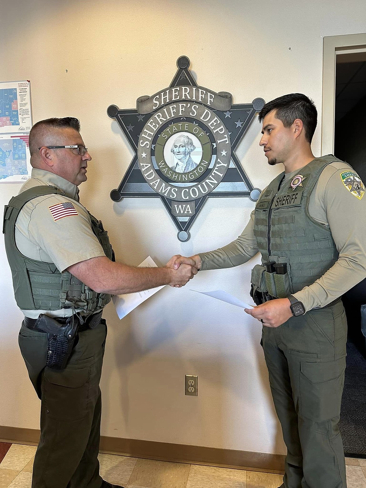 Adams County Sheriff Dale Wagner, left, swears in the ACSO’s newest deputy, Oscar Munoz Monday. Munoz, originally from Othello, graduated from Washington State University with a degree in criminal justice, according to an announcement from the ACSO.