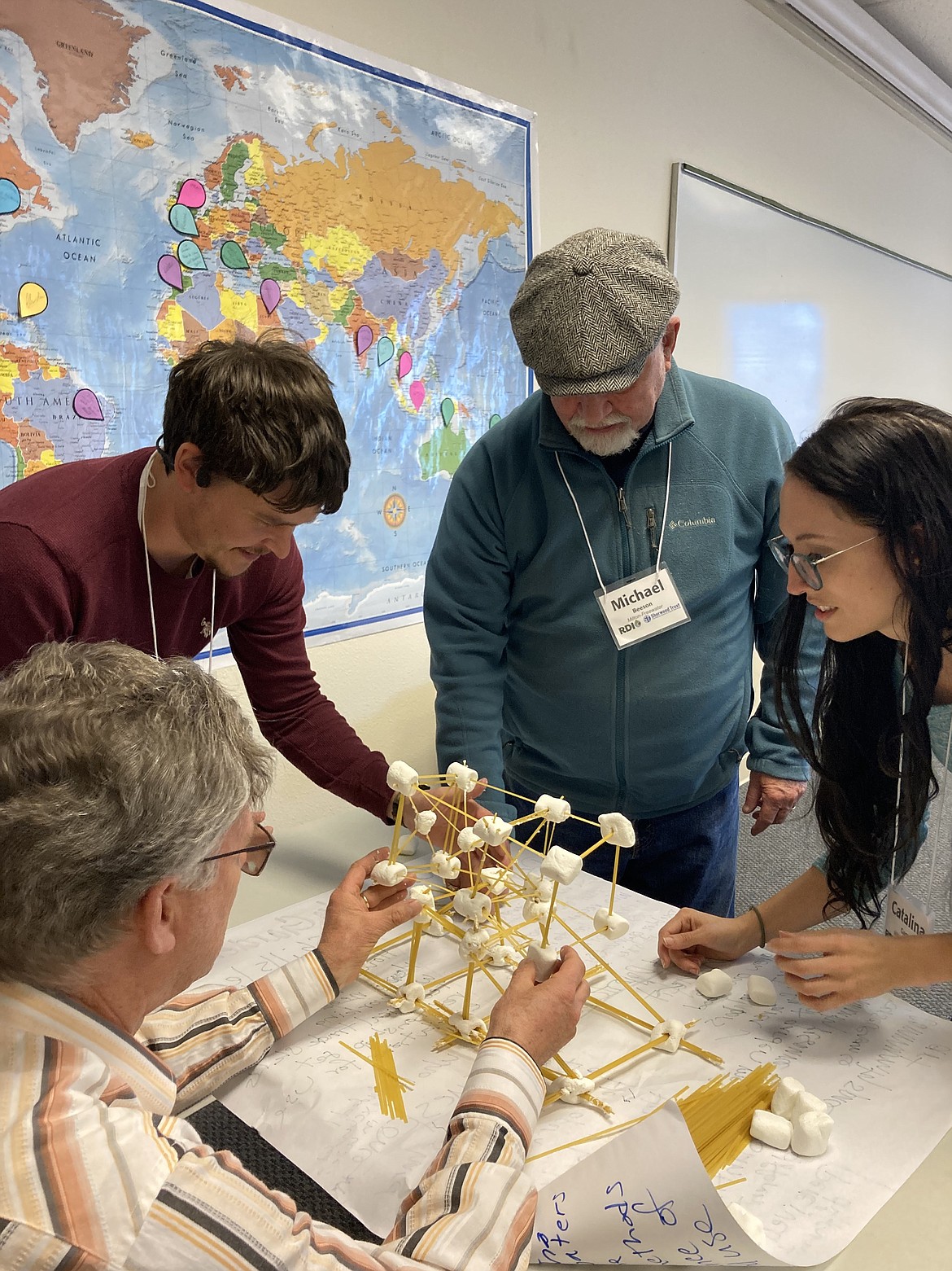 Cohort members of the Rural Community Leadership Program in Milton-Freewater perform a teamwork exercise that challenges them to communicate effectively.
